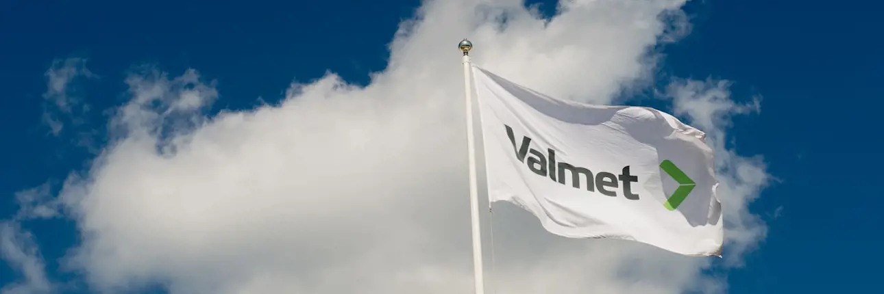 The Valmet flag flies in the air