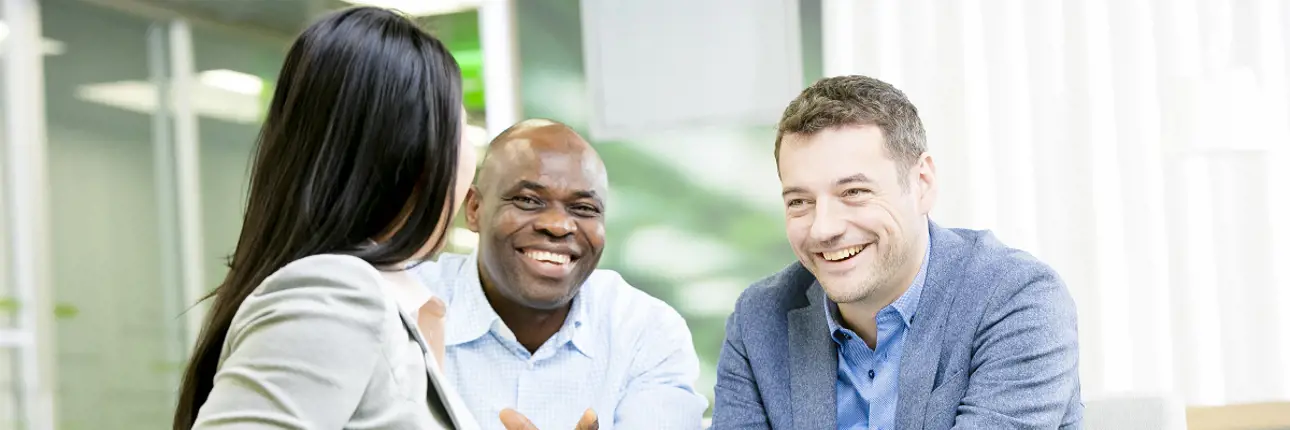 Three Valmet employees discussing together